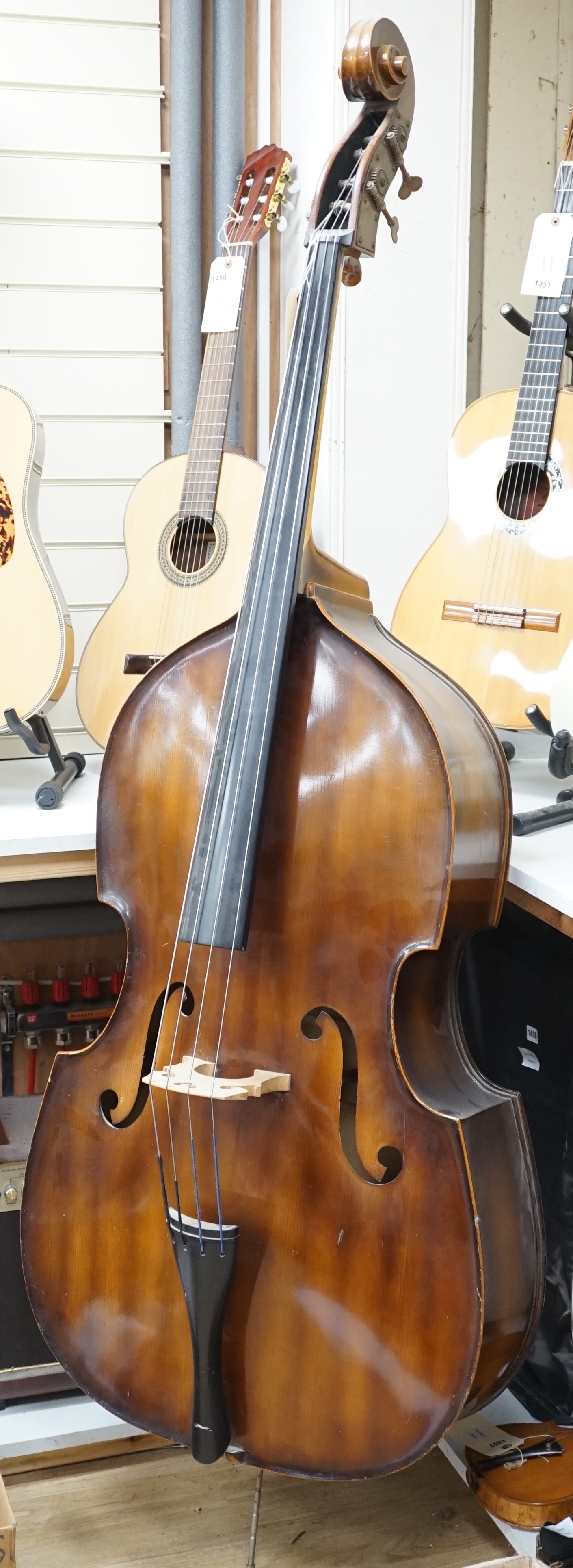 A Hungarian double bass with label to interior reading 'Golden Strad, imported by Boosey & Hawkes, London, Made in Hungary'